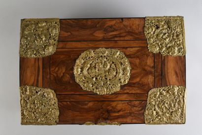 null Walnut veneer chest, rich ornamentation of brass embossed, openwork and gilded.
H...