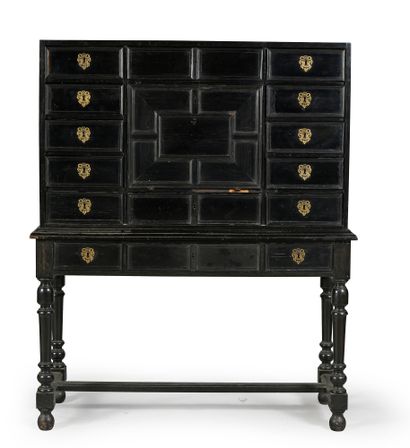 null Ebony cabinet opening with 12 drawers and a flap, revealing 8 drawers veneered...