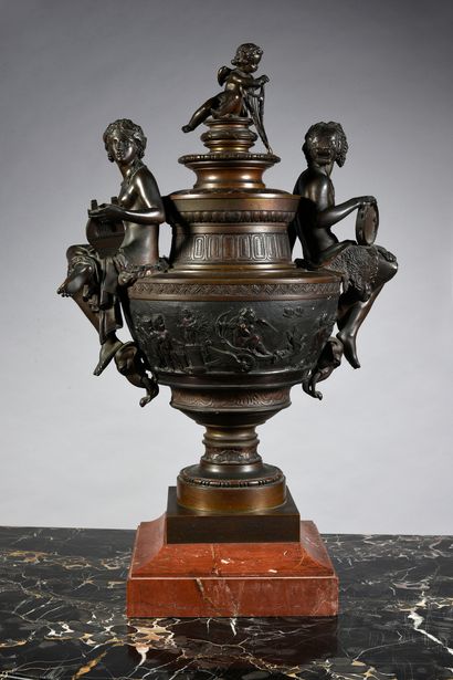 null A large covered bronze baluster vase with a brown patina, the body decorated...