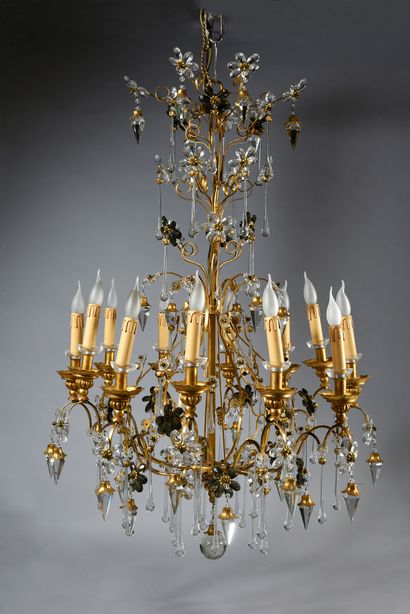 null Pair of 12-light wrought iron and gilded chandeliers, decorated with drops,...