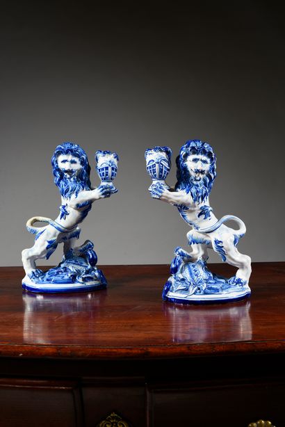 Saint Clément. Émile Gallé. 
Pair of lions carrying torches in white and blue enamelled...