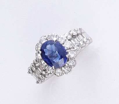 850th platinum ring, set with an oval sapphire...
