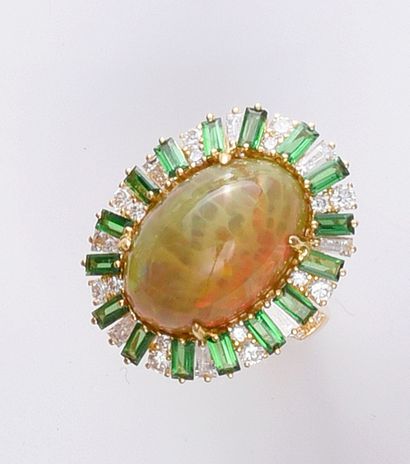 Yellow gold ring set with a large oval opal...