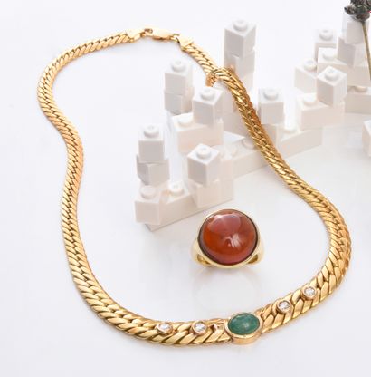 Gold necklace with a curb chain, set with...