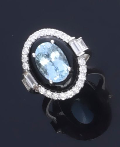 null 750th white gold ring, set with a 2.81 carat oval aquamarine in a setting of...