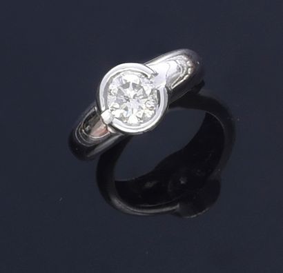 null 750th white gold ring set with a brilliant-cut diamond weighing approximately...