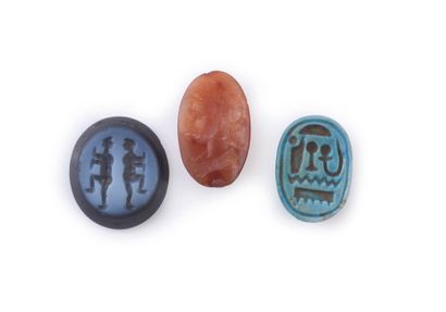 null Lot including a blue frit scarab, a carnelian intaglio with a Ceres figure (crack)...