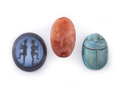 null Lot including a blue frit scarab, a carnelian intaglio with a Ceres figure (crack)...
