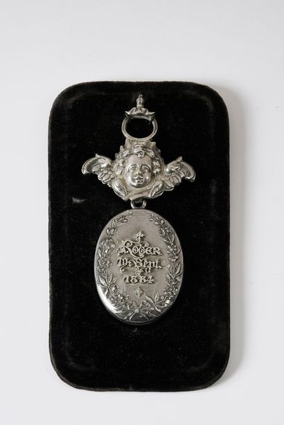 Silver souvenir medallion engraved with an...
