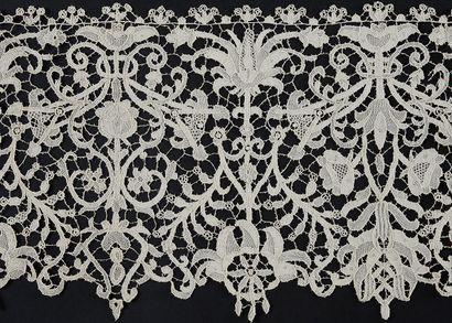 null Needlepoint lace border, late 19th century.
Punto in Aria type, decorated in...