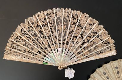 null Two fans, circa 1900 *One, the silk leaf painted with branches enhanced with...