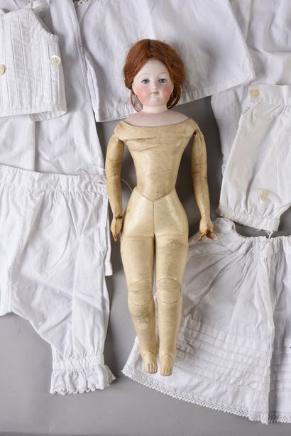 null PARISIENNE type fashion doll with pressed bisque head/bust, blue painted eyes,...
