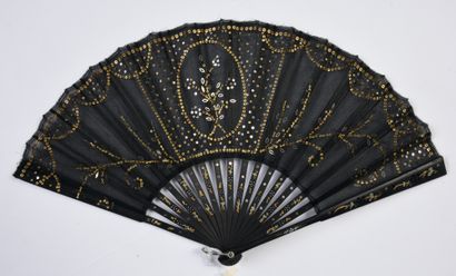 null Sequins, circa 1900-1920
Two fans.
*One, the beige leaf embroidered with stylized...