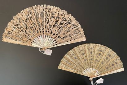 null Two fans, circa 1900 *One, the silk leaf painted with branches enhanced with...