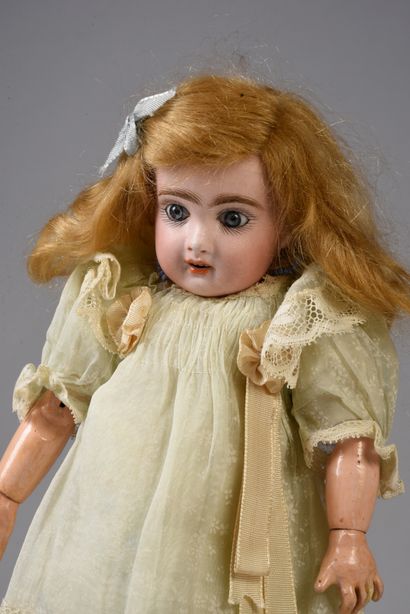 null French doll, considered a BLEUETTE of 1905, with bisque head, open mouth, marked...