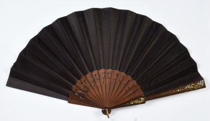 null The Kiss, ca. 1890
Folded fan, the cream satin sheet painted with a couple exchanging...
