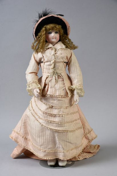 null Parisienne type fashion doll, with head marked 4 and bust in pressed bisque...