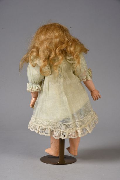 null French doll, considered a BLEUETTE of 1905, with bisque head, open mouth, marked...