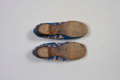 null Two pairs of slippers, mid-19th century, tapestry stems decorated with rose...