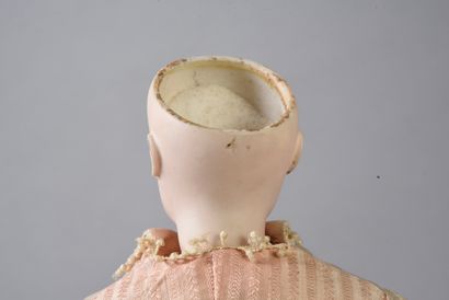 null Parisienne type fashion doll, with head marked 4 and bust in pressed bisque...
