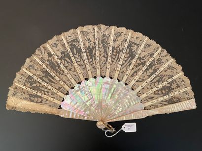 null Sous-bois, circa 1880
Folded fan, the leaf in needle lace decorated with bells,...
