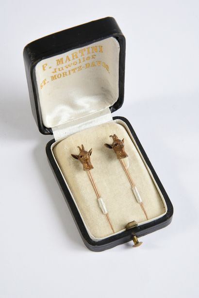 Pair of gold chamois head pins, kept in their...