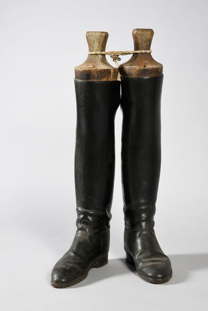 null Pair of hunting boots with their wooden shoe trees, bears a handwritten label:...