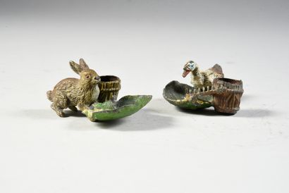 null Nuremberg lead.
Pair of inkwells with bucket and cabbage leaf.
One with a goose...