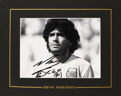 null Diego Maradona. Photo autographed by the player under the jersey of the Argentine...