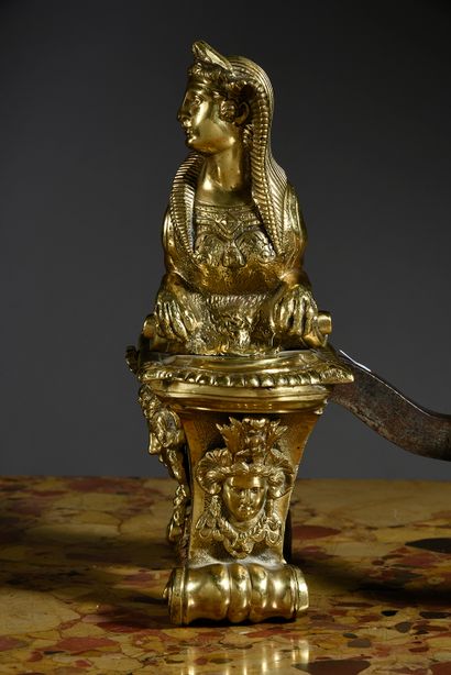 null Pair of chased and gilded bronze lights, model with sphinxes in the style of...