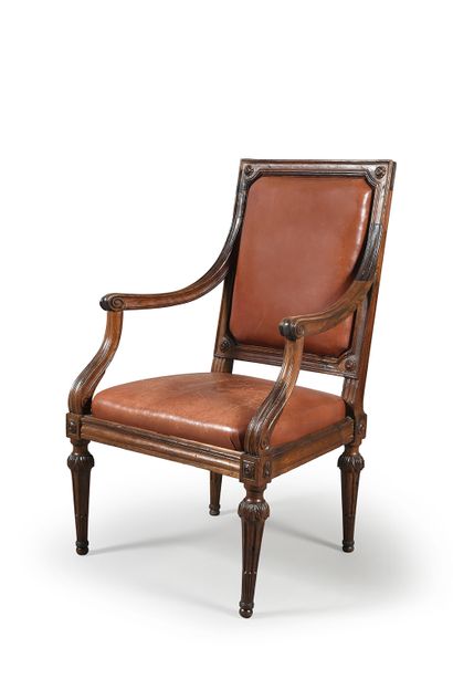 null Armchair with molded walnut frame, the rectangular back with rounded angles...