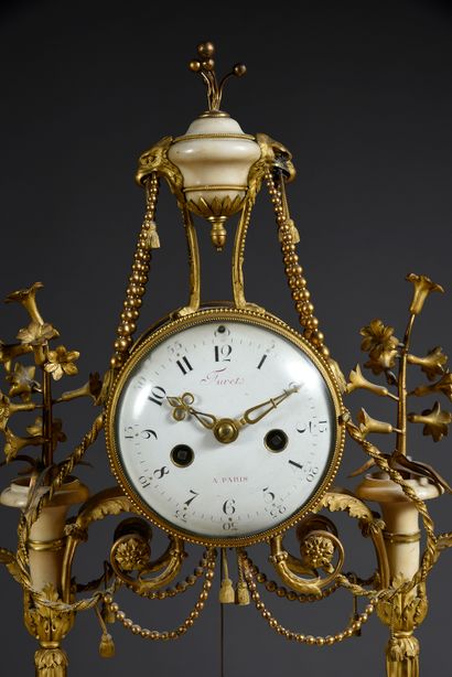null Portico clock in chased and gilded bronze and white marble, the dial supported...