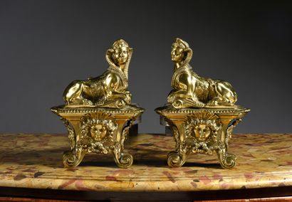 null Pair of chased and gilded bronze lights, model with sphinxes in the style of...