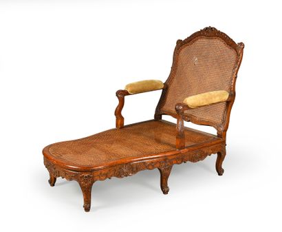 null Long caned chair in molded and carved beech and waxed, it rests on six arched...