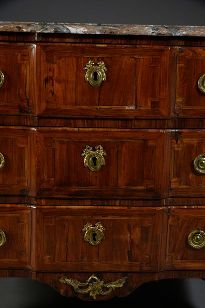 null Chest of drawers with a central recess opening to three drawers, decorated with...