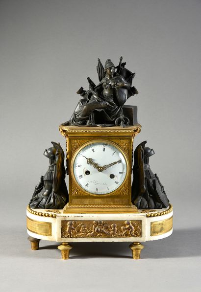 null A white marble, chased bronze, patinated and gilt clock, standing on six toupie...