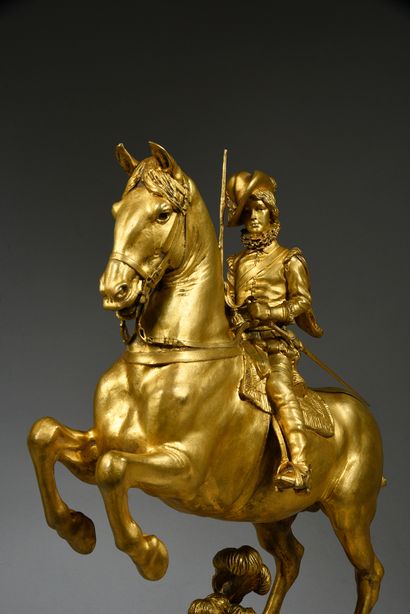 Emmanuel FREMIET ( 1824 - 1910) Louis XIII enfant à cheval.
Bronze à patine doré,...