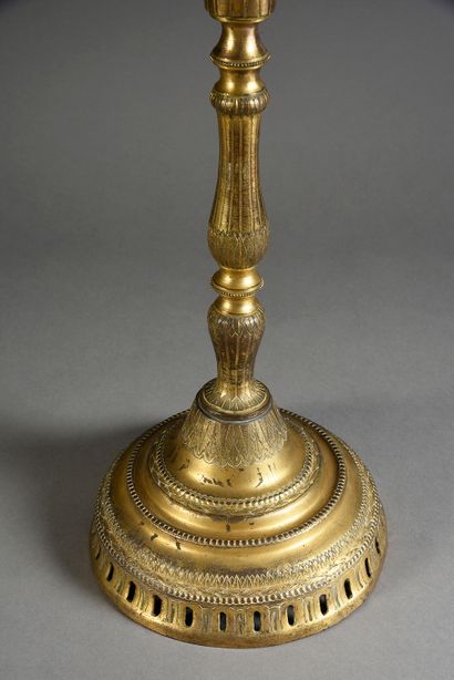 TOMBAK Important gilded copper torch known as Tombak the shaft of baluster form with...