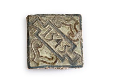null Two small tiles in Spanish earthenware of the 16th century One dated in manganese...