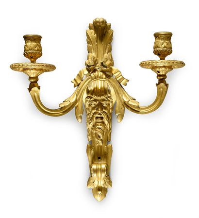 null Pair of sconces in chased and gilded bronze, with two arms of lights, the plate...