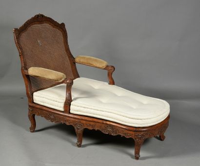 null Long caned chair in molded and carved beech and waxed, it rests on six arched...