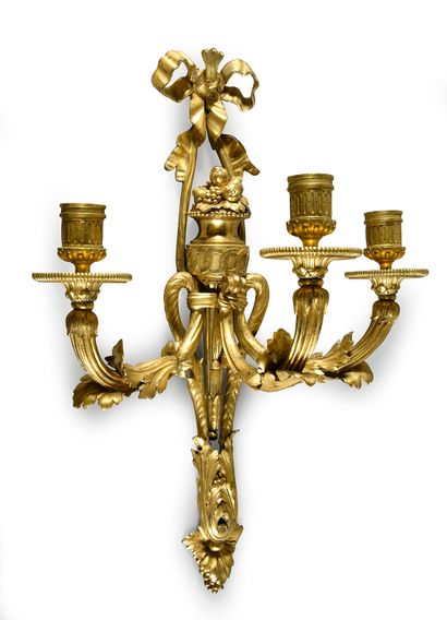 null Pair of sconces with three arms of lights, the plate finished by a base in acanthus...