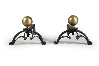 Vers 1580 Pair of wrought iron andirons, large molded base topped by a sphere engraved...