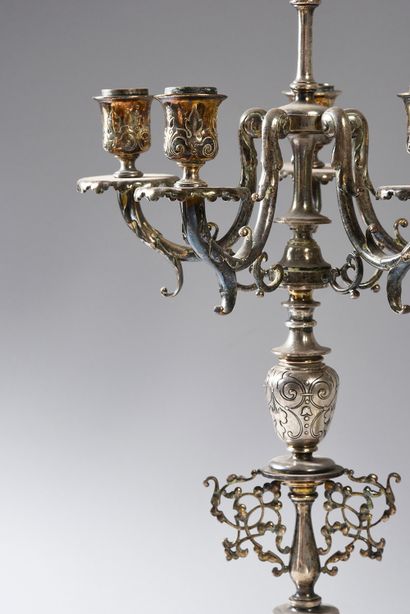 null Pair of candelabra in patinated and gilded bronze, the shaft is flanked by three...