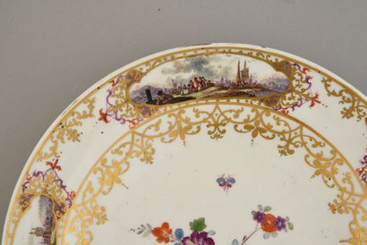 null Porcelain plate in the style of Meissen Marks in blue with two crossed swords
Decorated...