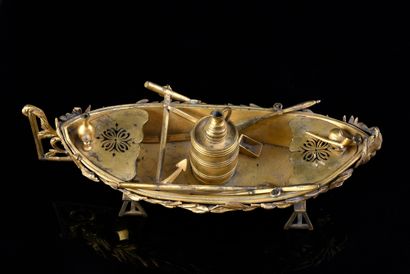 null Inkwell in chased and gilded bronze in the shape of a boat equipped with oars,...