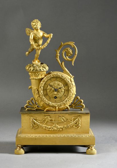 null Chased and gilt bronze clock, decorated with a cornucopia surrounding the movement,...