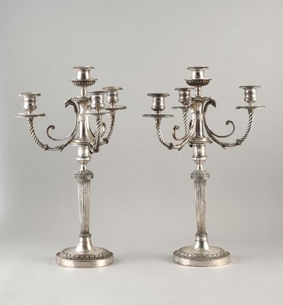 null Pair of candelabras in silver plated metal with four arms of lights decorated...