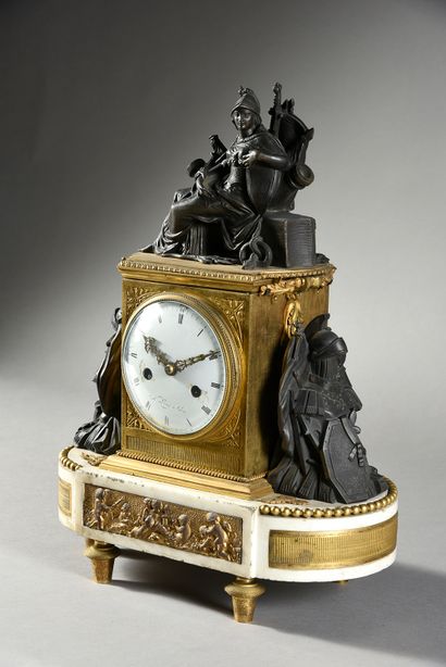 null A white marble, chased bronze, patinated and gilt clock, standing on six toupie...