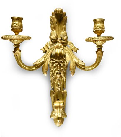null Pair of sconces in chased and gilded bronze, with two arms of lights, the plate...